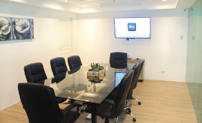 Boardroom for one-on-one or virtual meetings with widescreen HDTV .